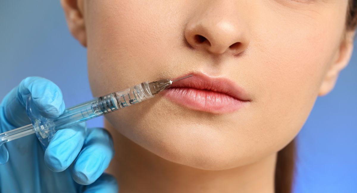 a woman's lips undergoing a botox treatment injection