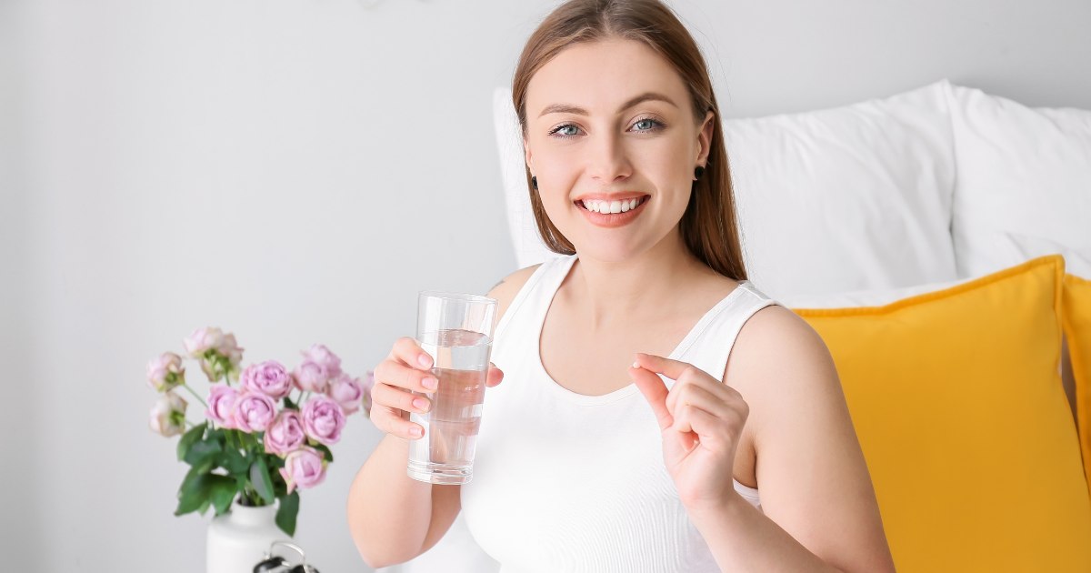 a cheerful woman taking medication